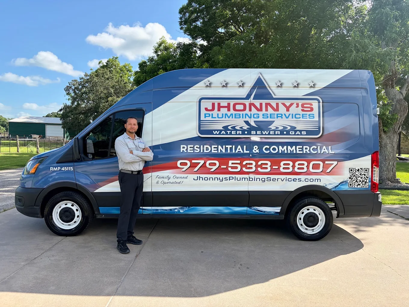Jhonny standing beside the Jhonny’s Plumbing Services van